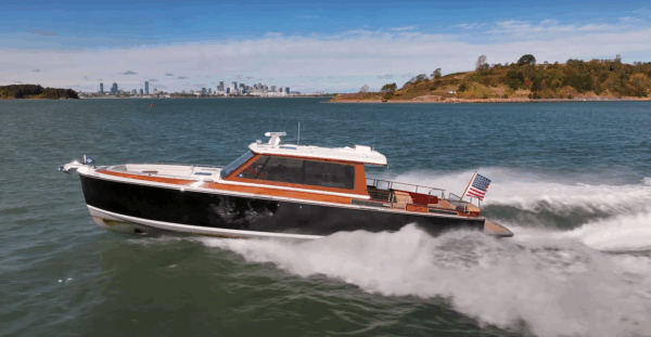 Boston Boat Works 48’ Daychaser Cruising – Boston Skyline Boston Boat Works 48’ Daychaser cruising at speed with the Boston skyline visible in the distance.