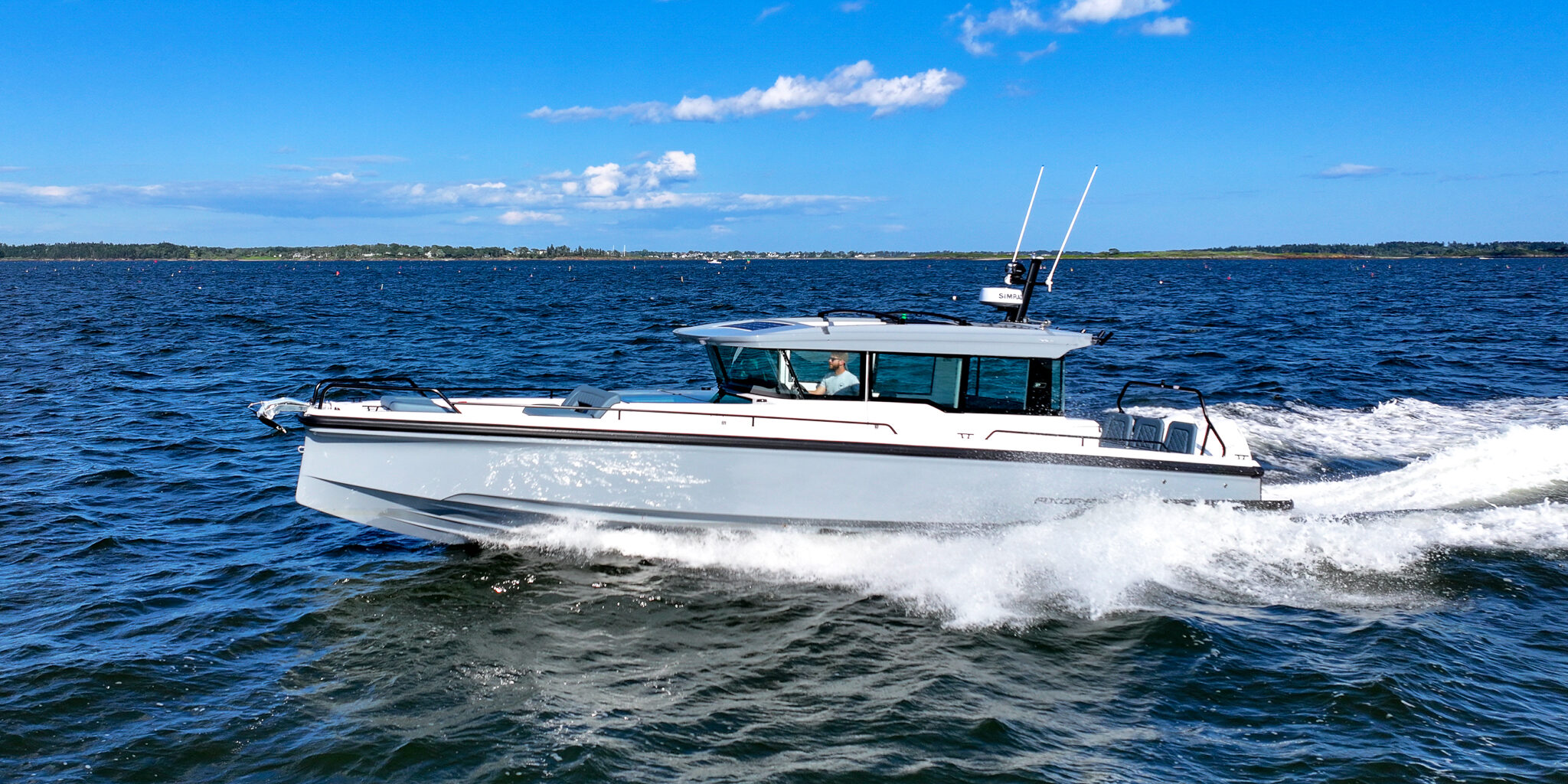 Axopar 45 XC Cross Cabin with Platinum Grey hull and BRABUS trim package cruising in Casco Bay, Maine.