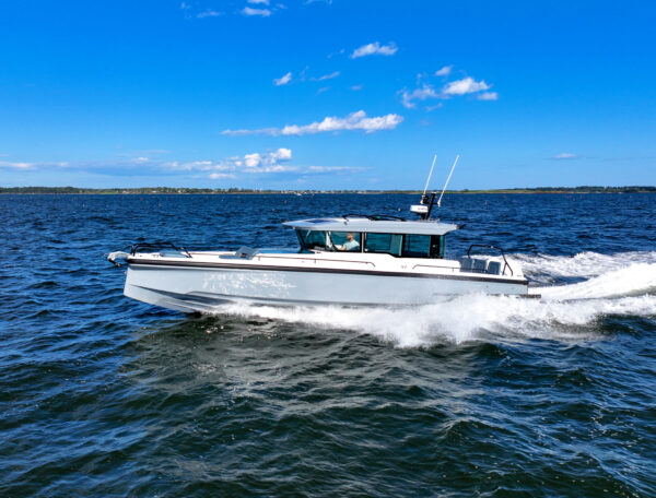Axopar 45 XC Cross Cabin with Platinum Grey hull and BRABUS trim package cruising in Casco Bay, Maine.