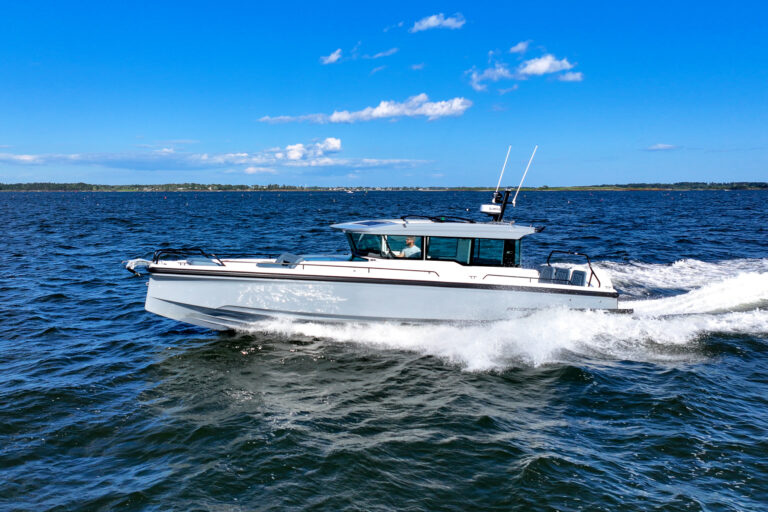 Axopar 45 XC Cross Cabin with Platinum Grey hull and BRABUS trim package cruising in Casco Bay, Maine.