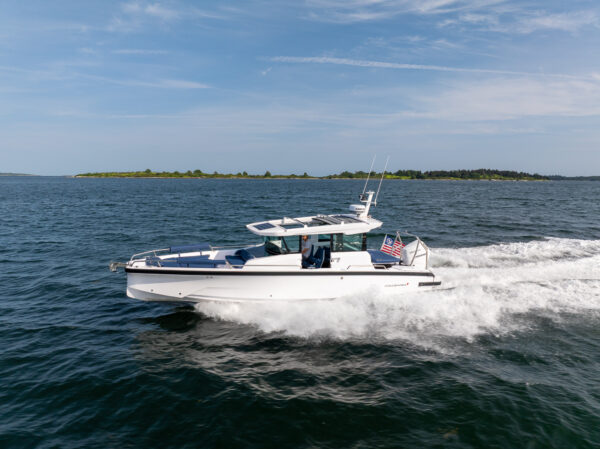 Axopar 29 XC Cross Cabin cruising in Casco Bay, Maine, photographed by East Coast Yacht Sales.