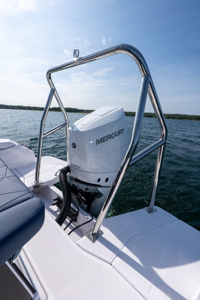 Close-up view of the stainless-steel ski tow bar and single Mercury V10 Verado outboard on the aft platform of an Axopar 29.