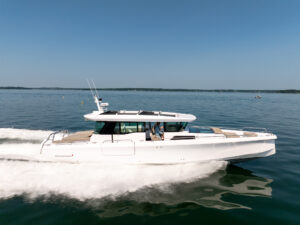 Axopar 45 XC Cross Cabin cruising in Casco Bay, Maine, photographed by East Coast Yacht Sales.
