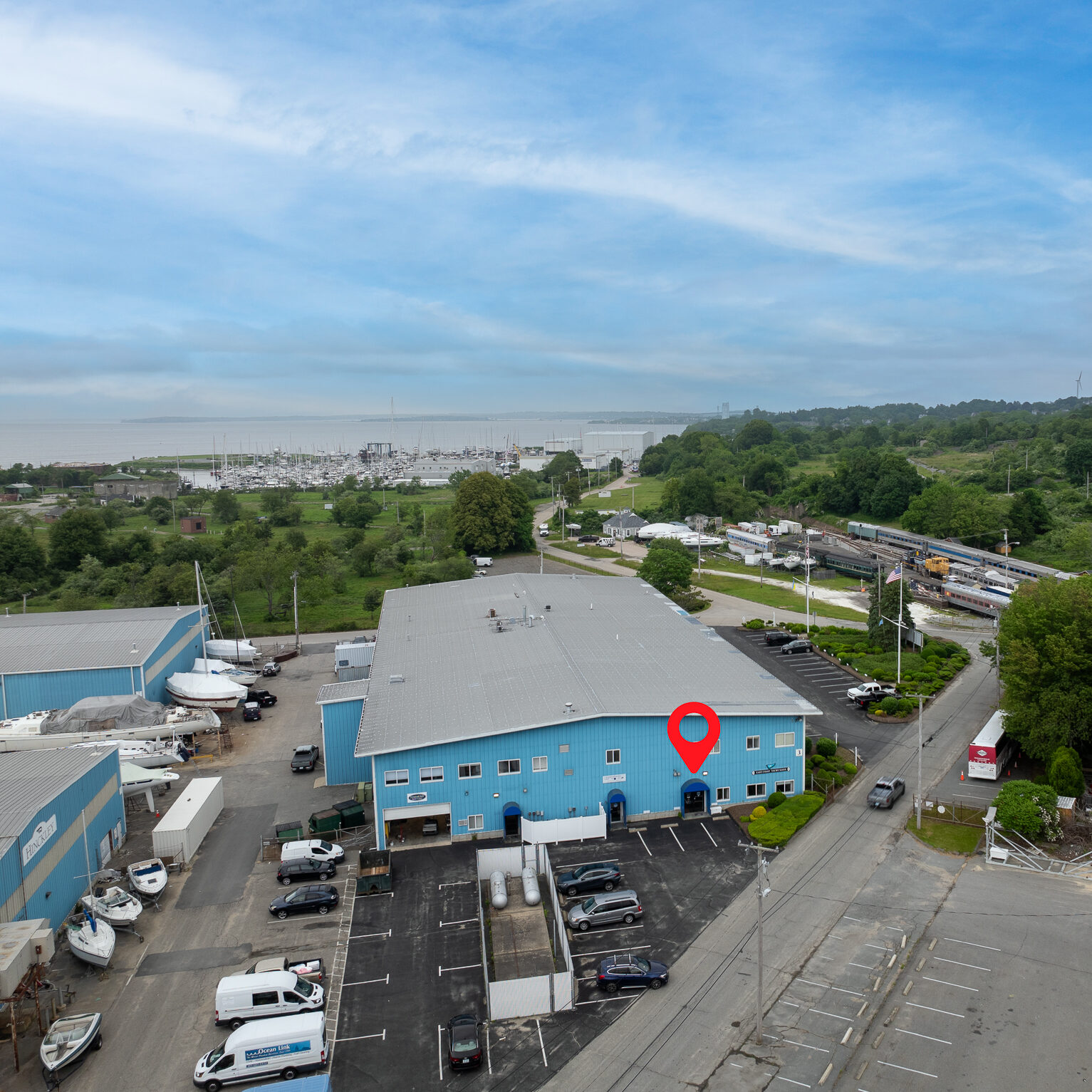 East Coast Yacht Sales – Portsmouth, RI Office Ariel shot of East Coast Yacht Sales' Portsmouth, Rhode Island office with the harbor in the background.
