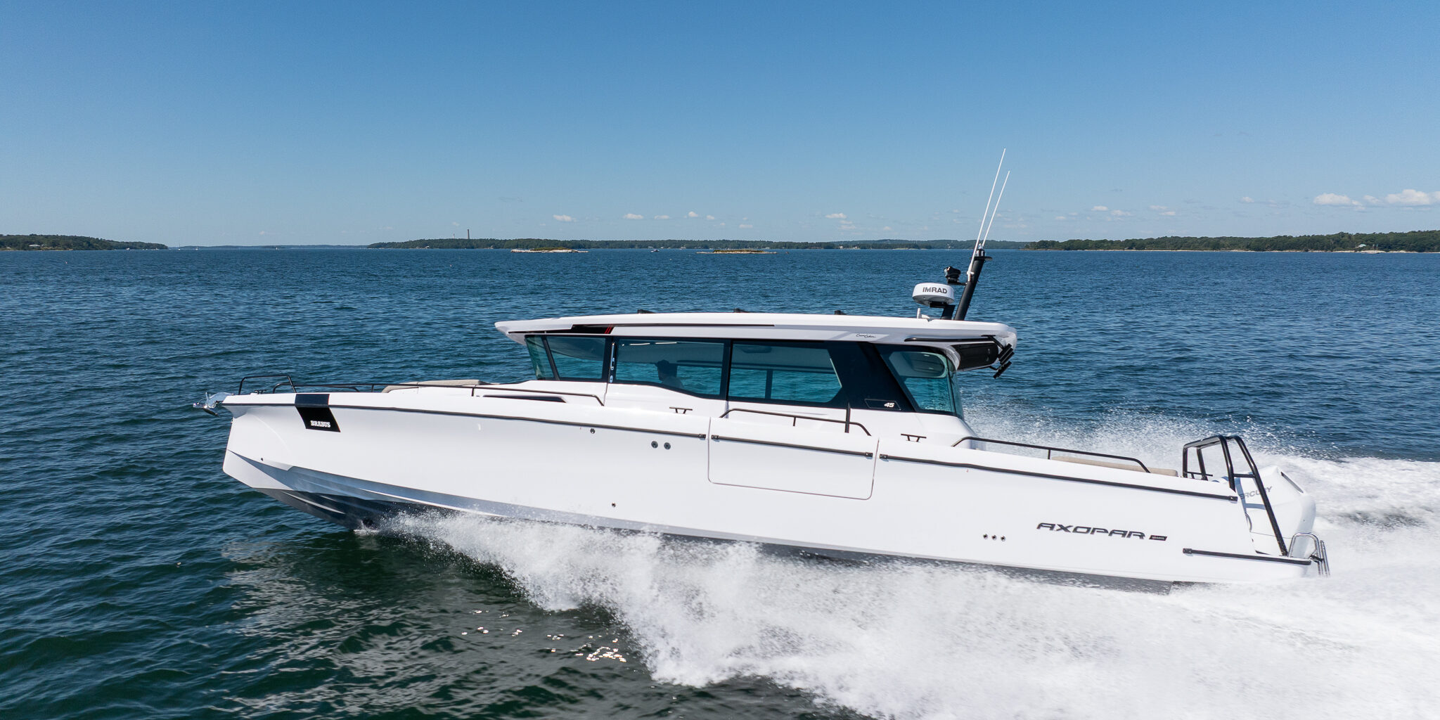Axopar 45 BRABUS Edition Cruising through Casco Bay, Maine on a sunny day