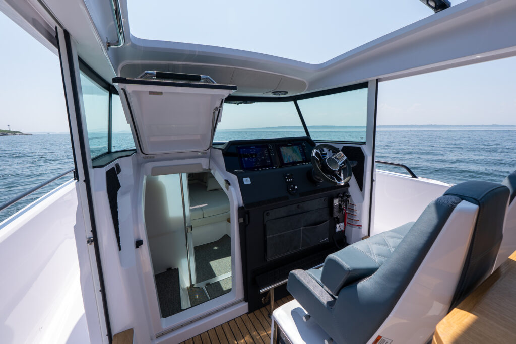Interior cabin of an Axopar 37 Cross Cabin BRABUS Edition featuring modern seating, clean lines, and bright natural light.