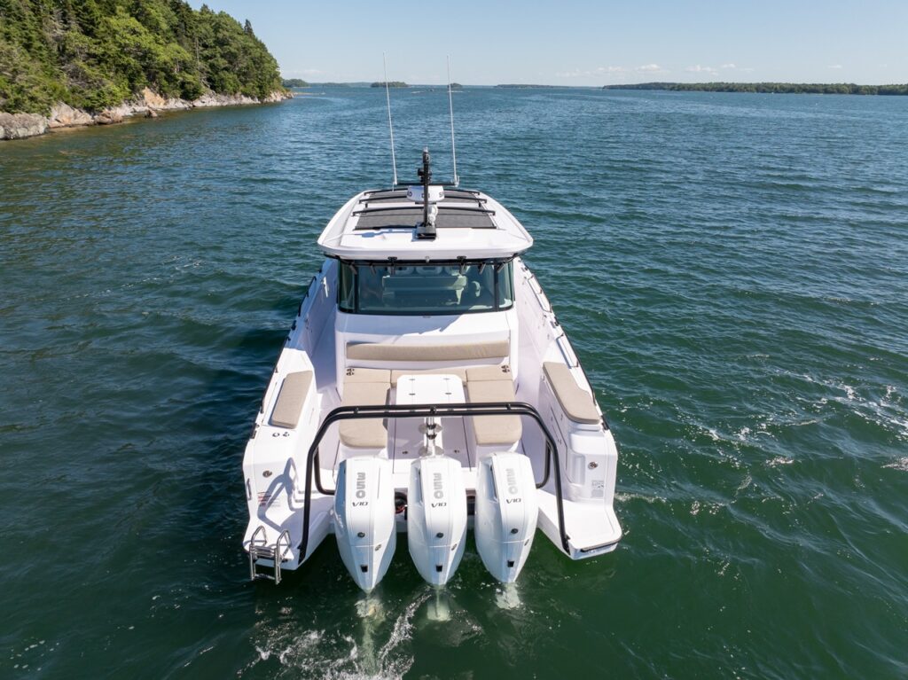 Aerial stern view of an Axopar 45 BRABUS Performance Line with three Mercury outboards cruising in Casco Bay, Maine.