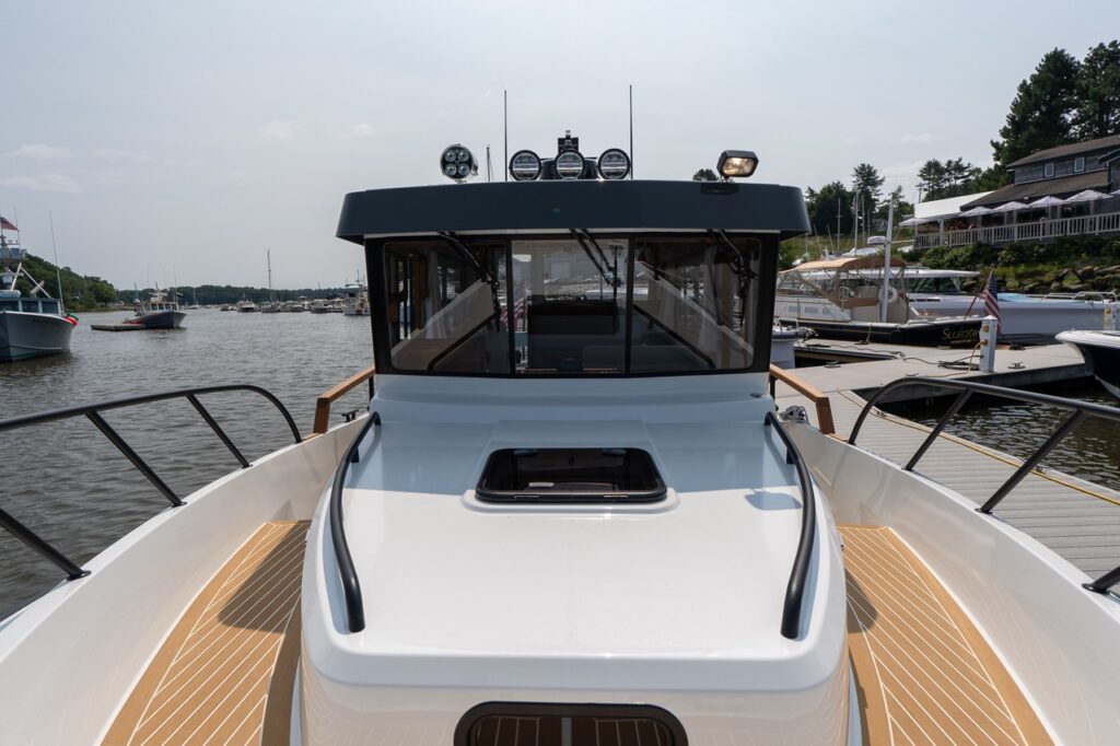 Forward deck view on the Targa 32 looking aft over the comfort forward cabin roof toward the enclosed pilothouse.
