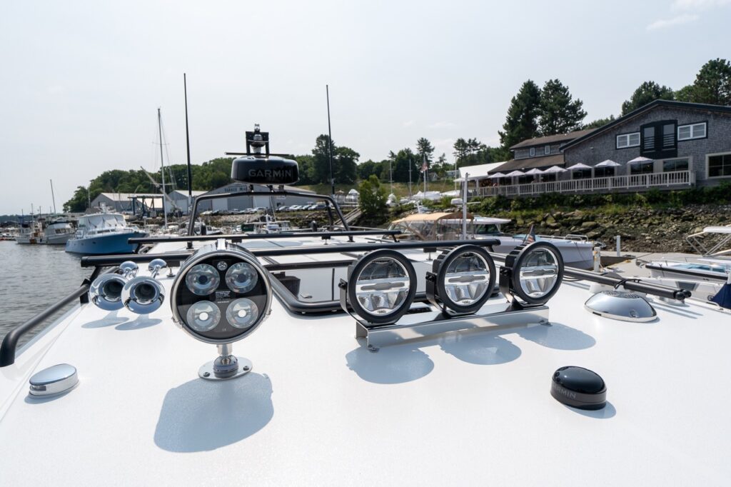 Roof-mounted electronics and lighting on the Targa 32, including Garmin radar, antennas, horn, and forward-facing deck lights.