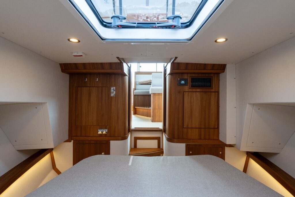 Targa 32 Comfort Forward Cabin with enlarged forward berth, skylight, and warm wood cabinetry.