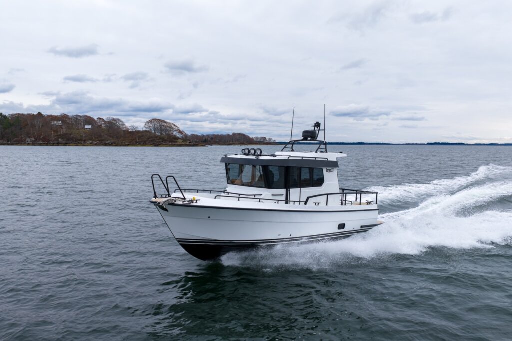 Targa 27.2 Coupe all-weather pilothouse boat cruising at speed in Casco Bay, Maine