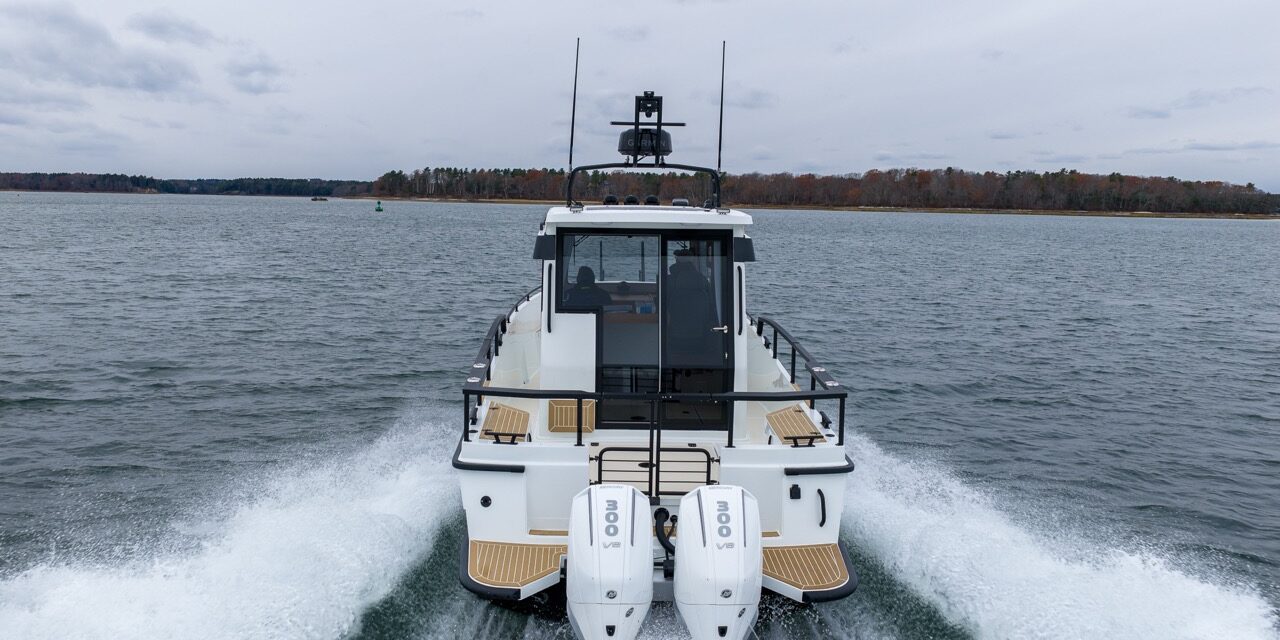Targa 27.2 Coupe with Twin Outboards Running in Casco Bay Maine Stern view of a Targa 27.2 Coupe with twin outboard engines cruising in Casco Bay, Maine
