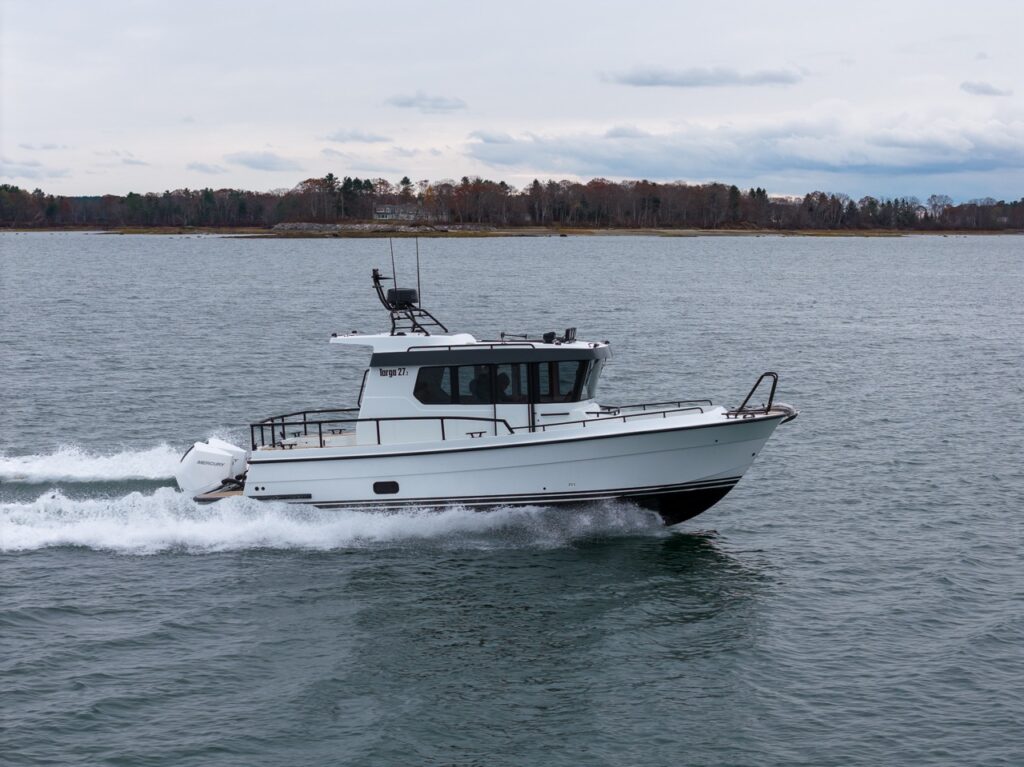 Side profile of a Targa 27.2 Coupe with outboard engine cruising in Casco Bay, Maine