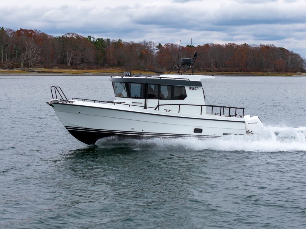 Side profile of a Targa 27.2 Coupe cruising underway across Casco Bay, Maine, with outboard engine.