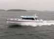 Axopar 38 running at speed in the Finnish archipelago off Helsinki during Axopar 38 media day, showcasing side profile and hull design in open water.