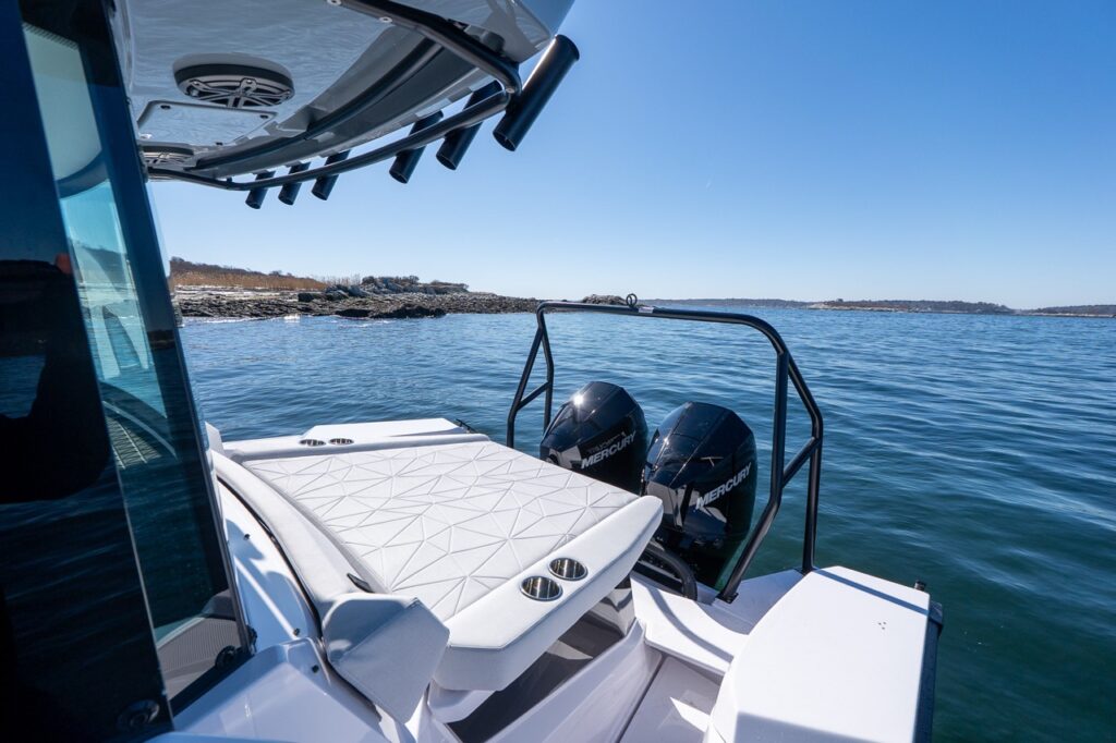 Axopar 29 aft sunbed in Chalk upholstery with twin Mercury outboards and swim platform