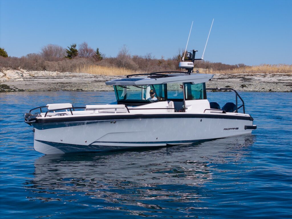 Axopar 29 Cabin on calm water with Platinum Gray hull and Chalk upholstery
