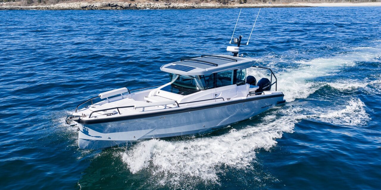 Axopar 29 Cabin underway with Chalk upholstery and Platinum Gray hull viewed from above