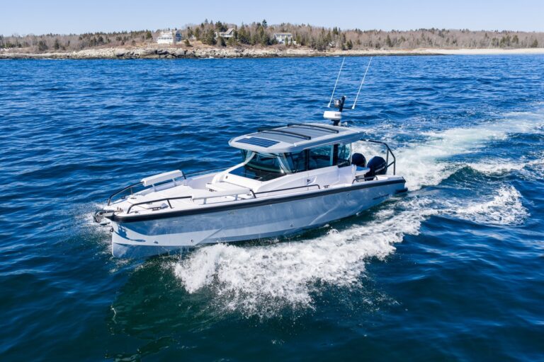 Axopar 29 Cabin underway with Chalk upholstery and Platinum Gray hull viewed from above